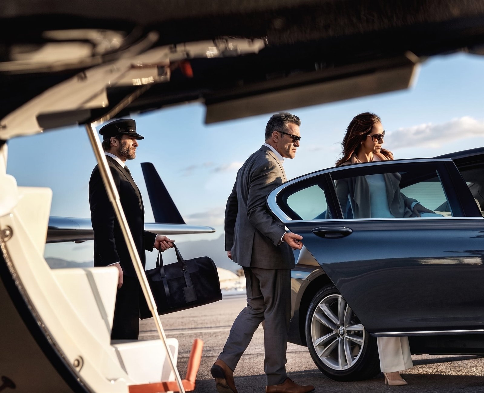 Chauffeur assisting passengers at the airport